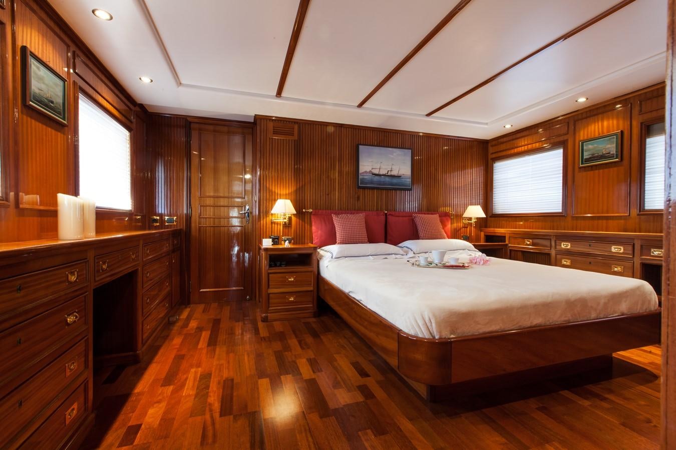 a bedroom with a bed and a desk aboard ANTARES OF BRITAIN Yacht for Sale