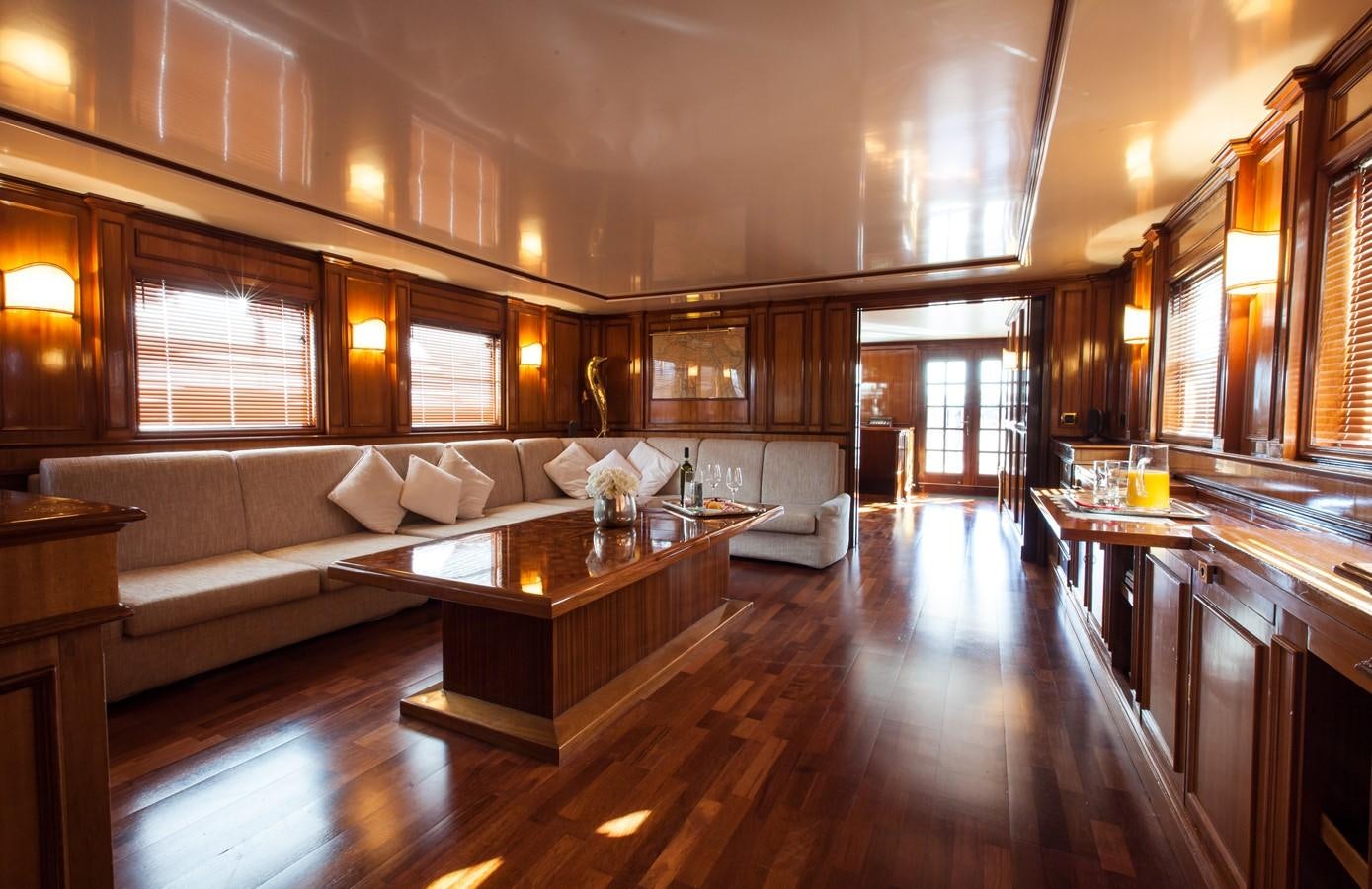 a large living room with a wood floor aboard ANTARES OF BRITAIN Yacht for Sale
