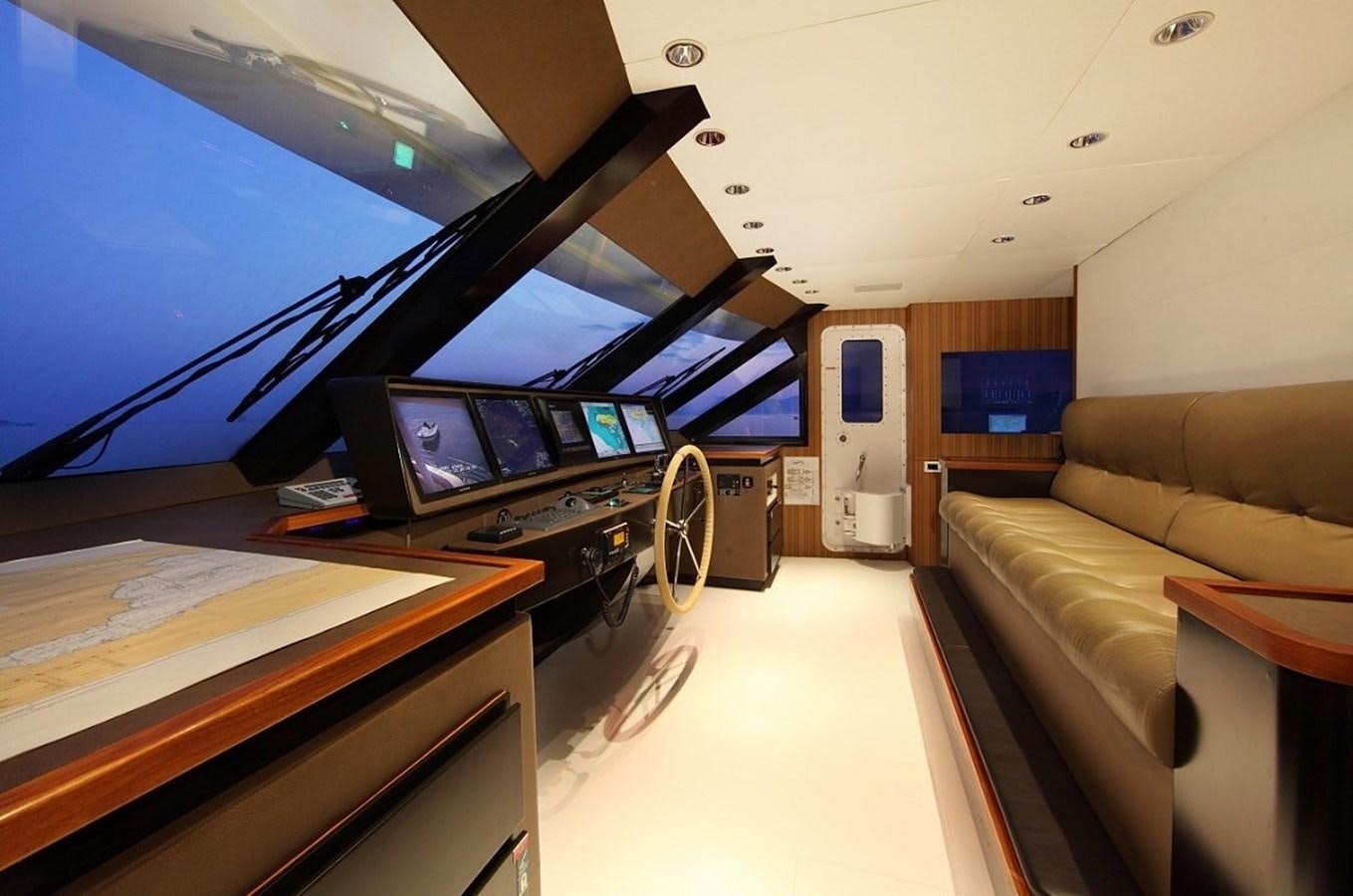 a living room with a large television aboard SEA SHELL Yacht for Sale