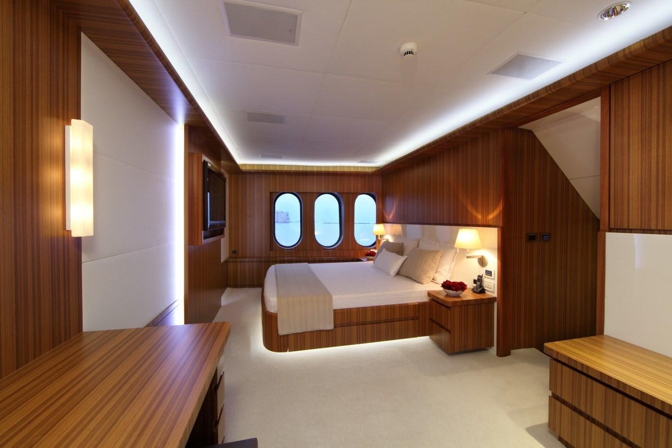 a room with a bed and a desk aboard SEA SHELL Yacht for Sale