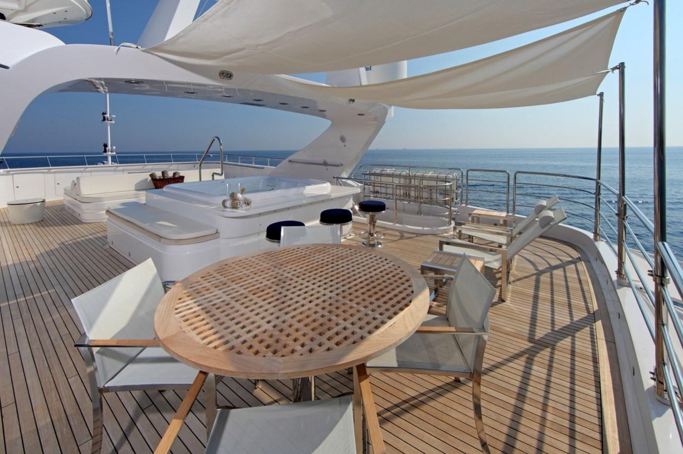 a deck with a large boat on it aboard SEA SHELL Yacht for Sale