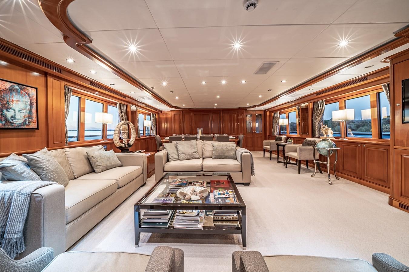 a living room with a couch and a coffee table aboard RELENTLESS Yacht for Sale