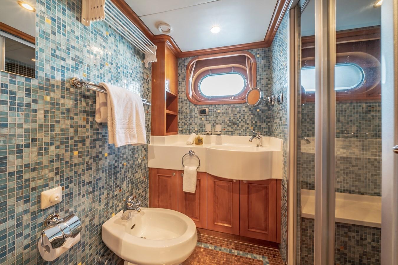 a bathroom with a tub sink and a sink aboard RELENTLESS Yacht for Sale