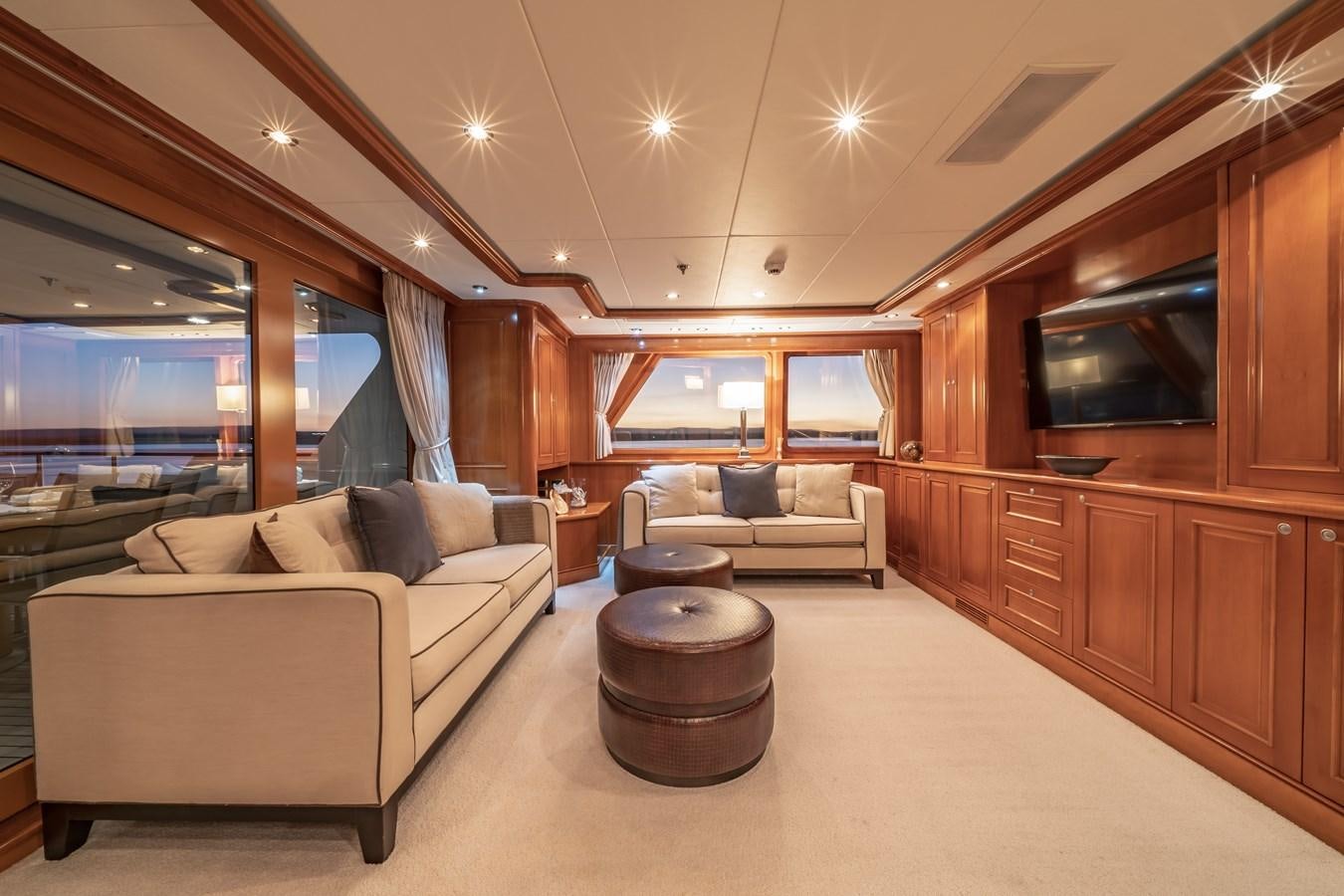 a living room with a couch and a tv aboard RELENTLESS Yacht for Sale