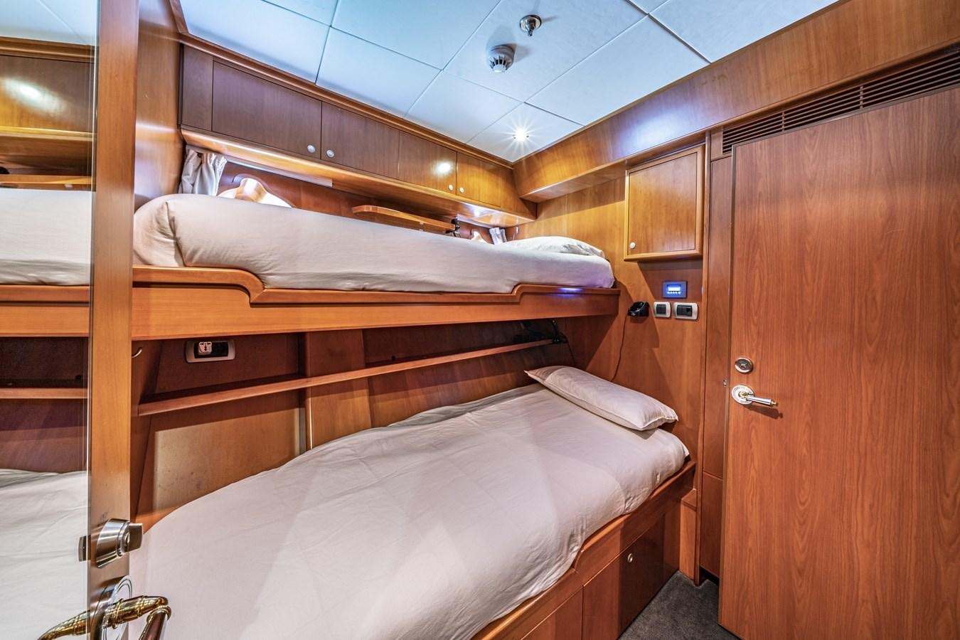 a bed in a room aboard RELENTLESS Yacht for Sale