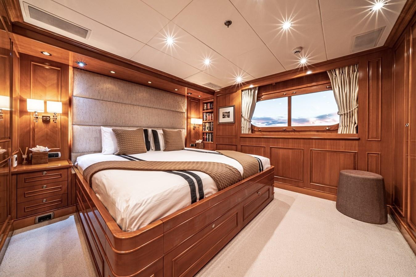 a room with a bed and a window aboard RELENTLESS Yacht for Sale