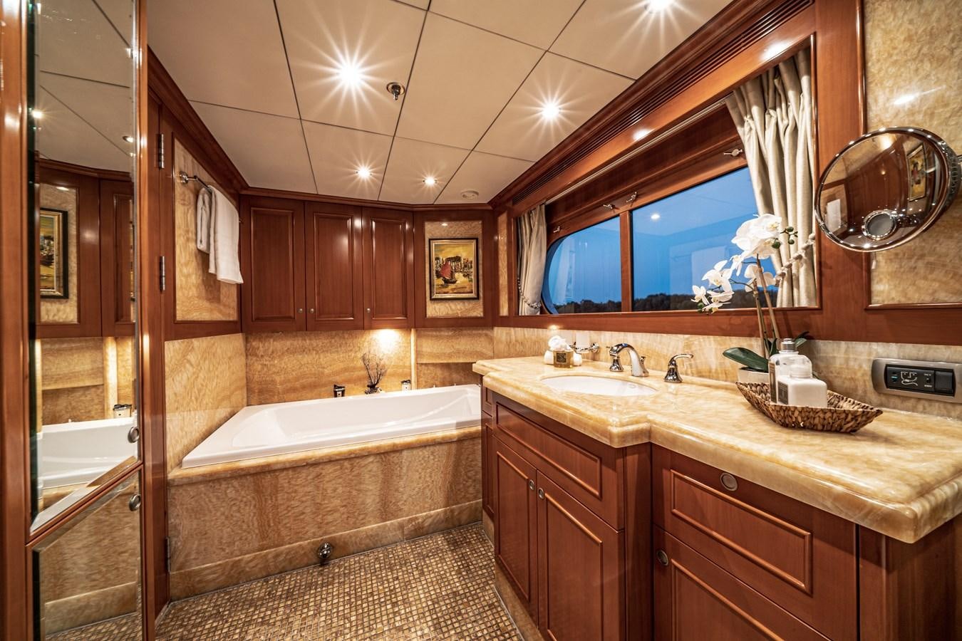 a bathroom with a large tub aboard RELENTLESS Yacht for Sale