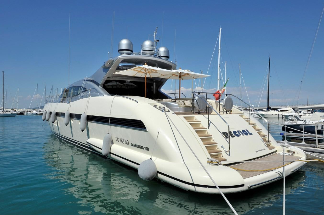 a large white boat in the water aboard MANGUSTA 108 - BECOOL - CAREFULLY USED Yacht for Sale