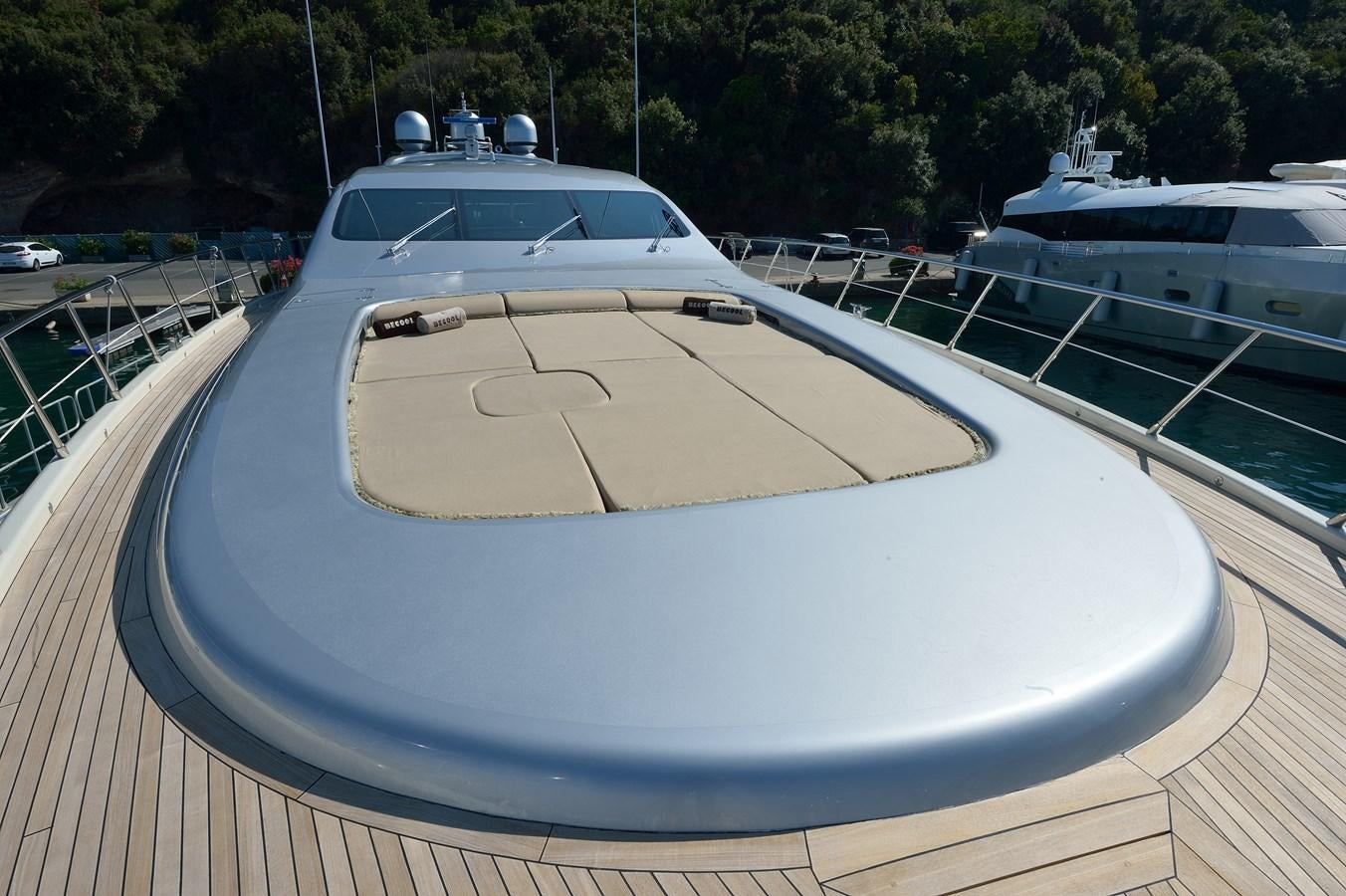 a white car on a bridge aboard MANGUSTA 108 - BECOOL - CAREFULLY USED Yacht for Sale