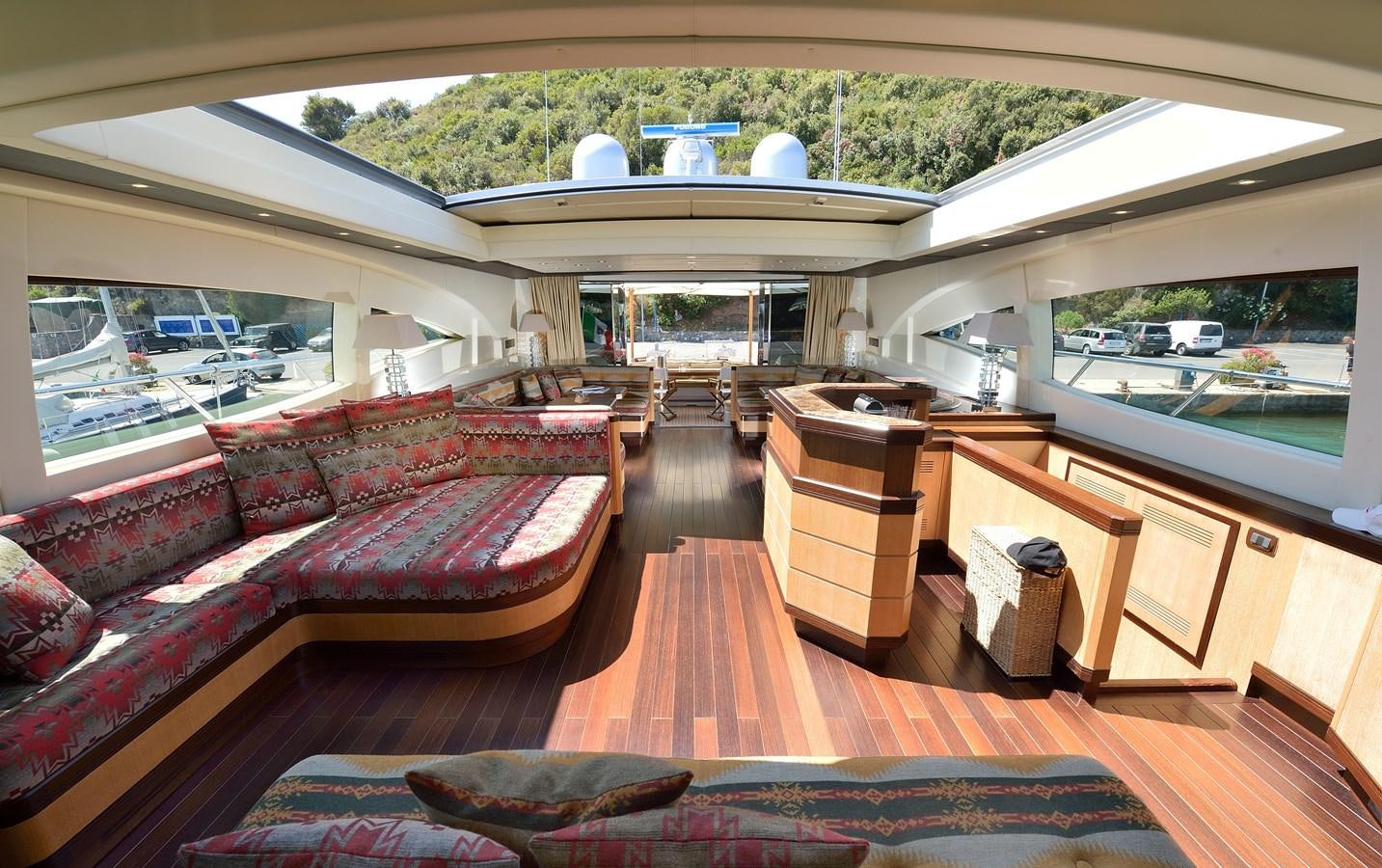 a room with a couch and a table aboard MANGUSTA 108 - BECOOL - CAREFULLY USED Yacht for Sale
