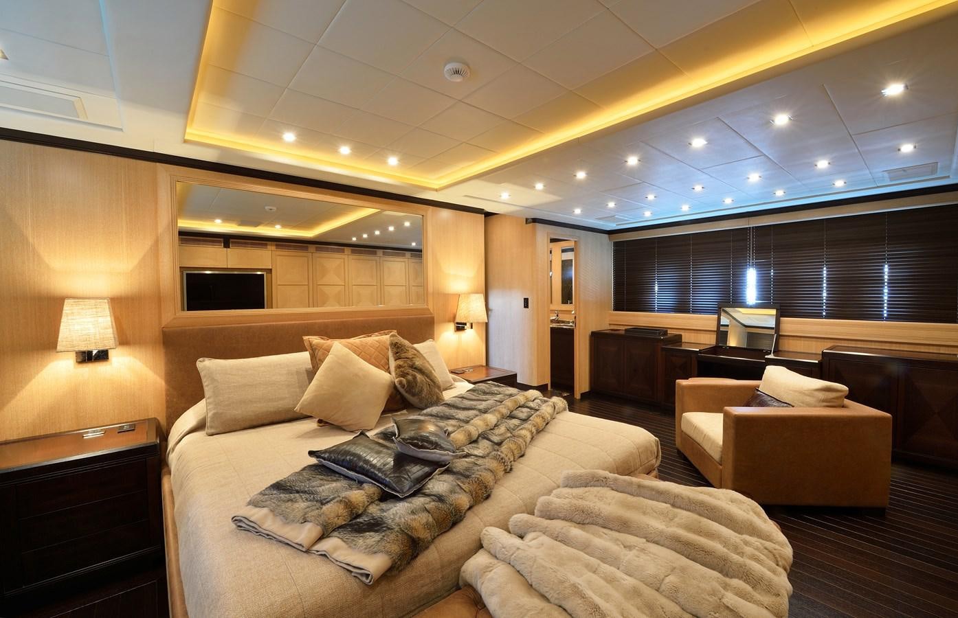 a large living room with a large bed and a large window aboard MANGUSTA 108 - BECOOL - CAREFULLY USED Yacht for Sale