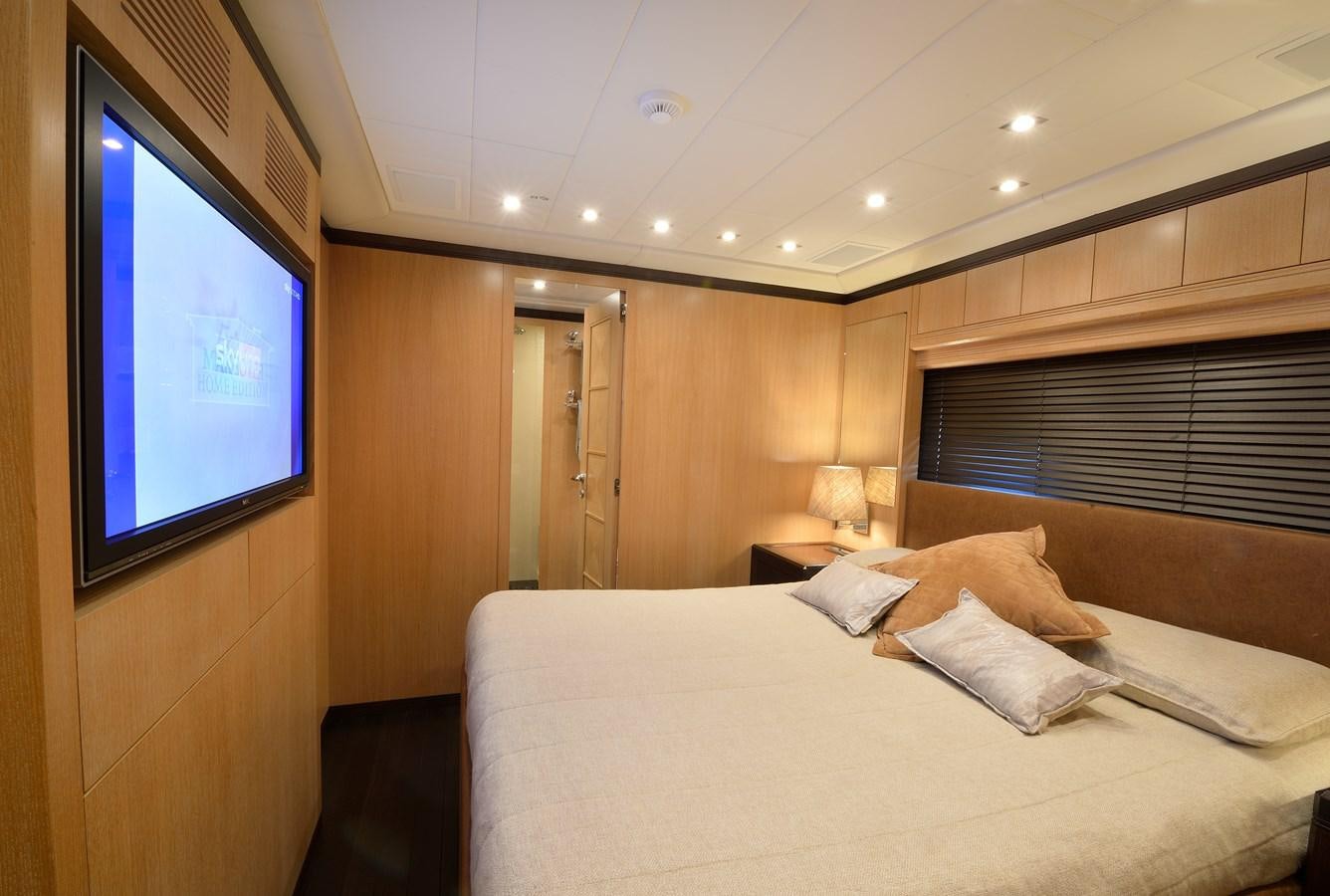 a bed in a room aboard MANGUSTA 108 - BECOOL - CAREFULLY USED Yacht for Sale