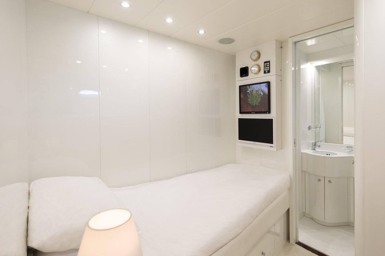 a white bathroom with a white bed aboard FATAMORGANA Yacht for Sale