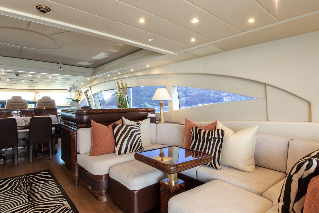 a living room with a couch and a table aboard FATAMORGANA Yacht for Sale