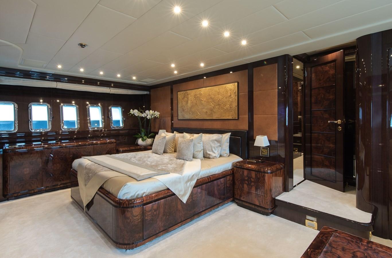 a large bedroom with a large bed aboard FATAMORGANA Yacht for Sale