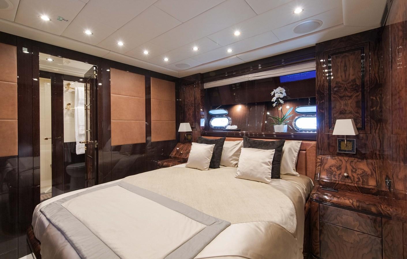 a room with a bed and a television aboard FATAMORGANA Yacht for Sale