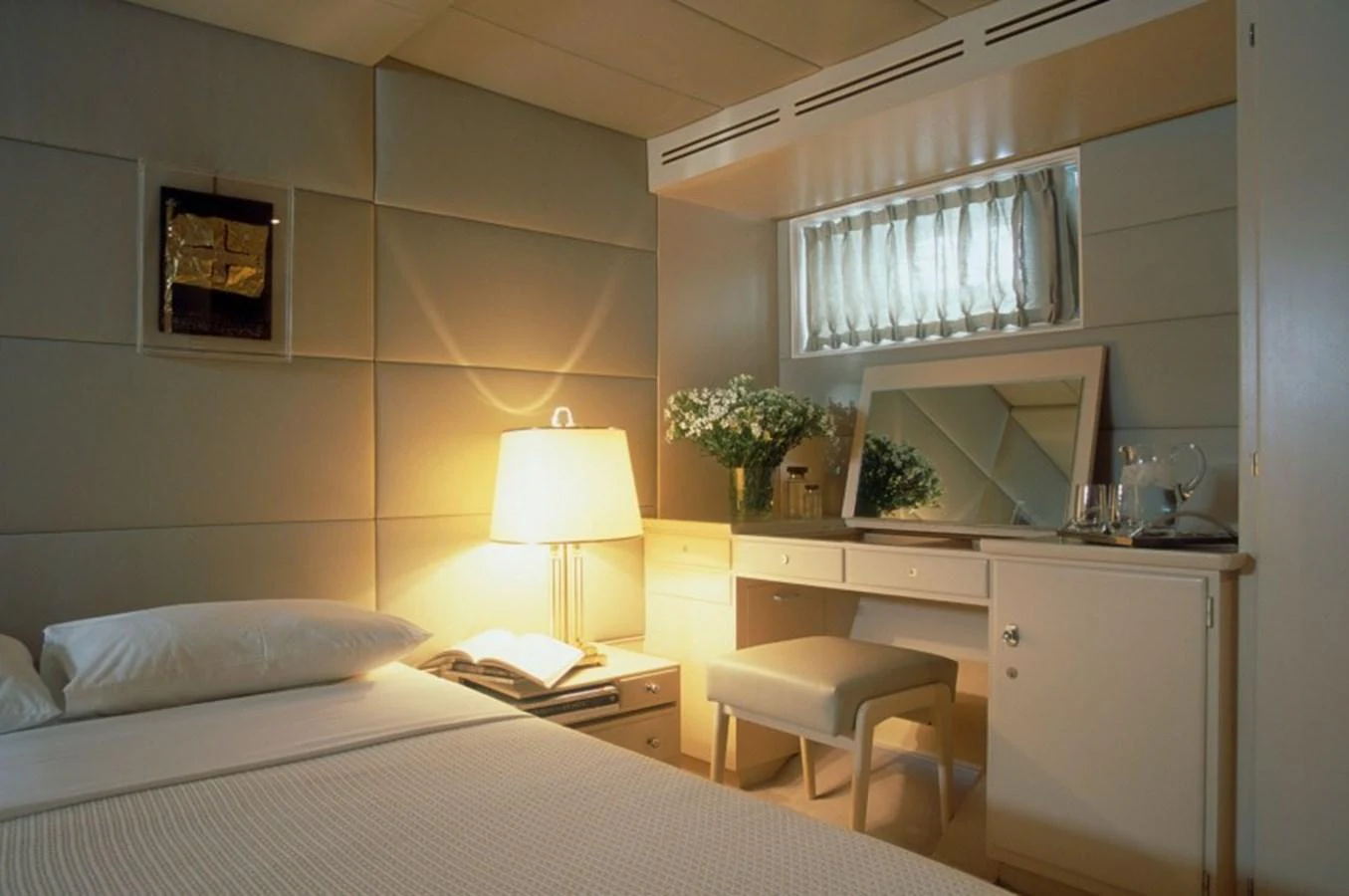 a bedroom with a bed and a desk aboard ALLAHOU Yacht for Sale