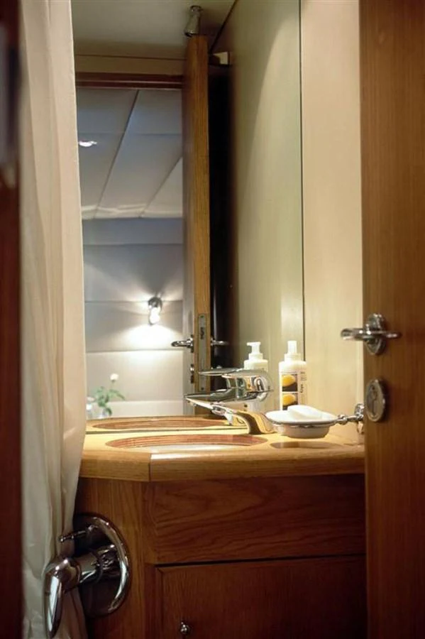 a bathroom with a sink and a mirror aboard ALLAHOU Yacht for Sale