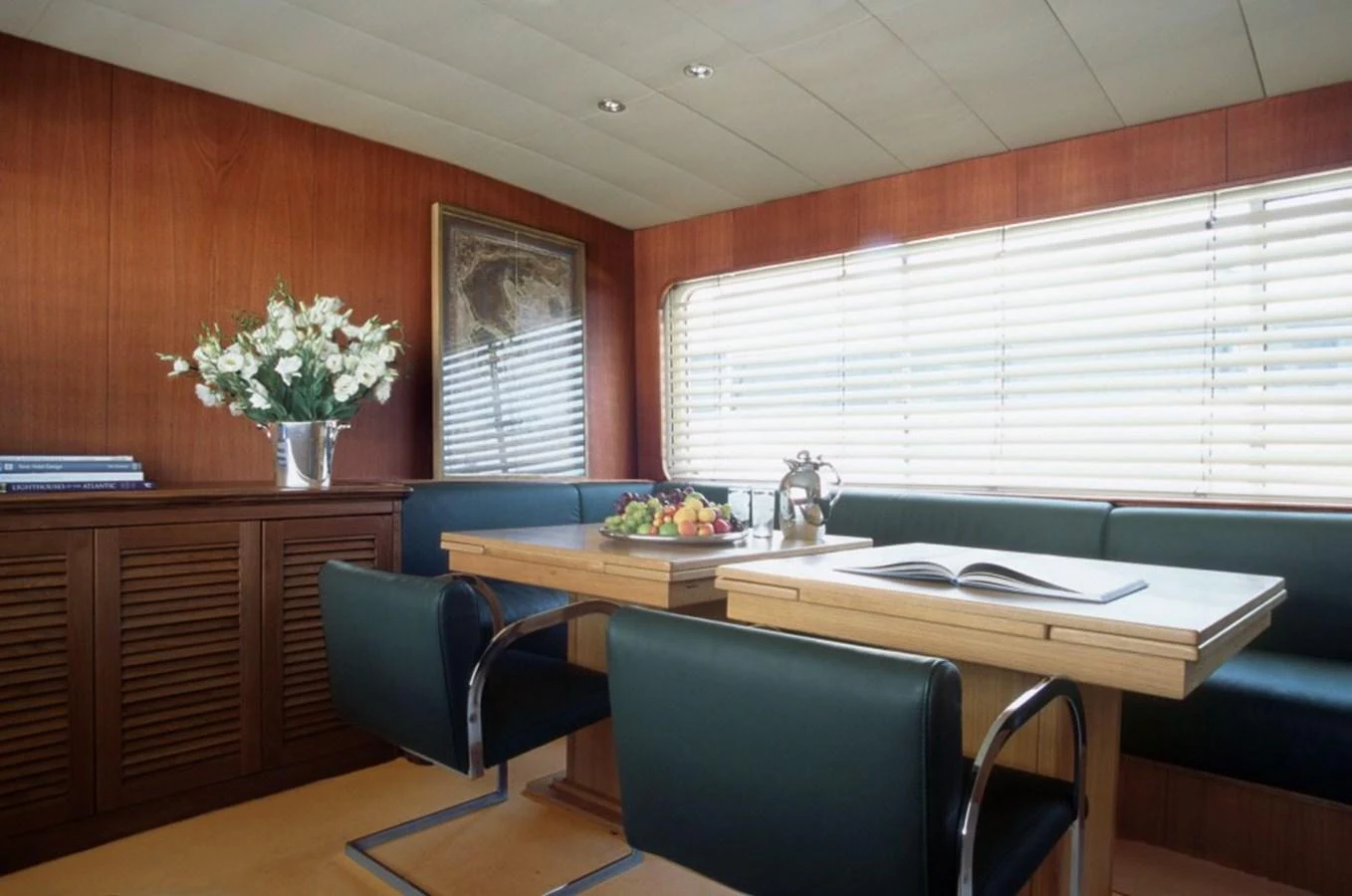 a room with a table and chairs aboard ALLAHOU Yacht for Sale