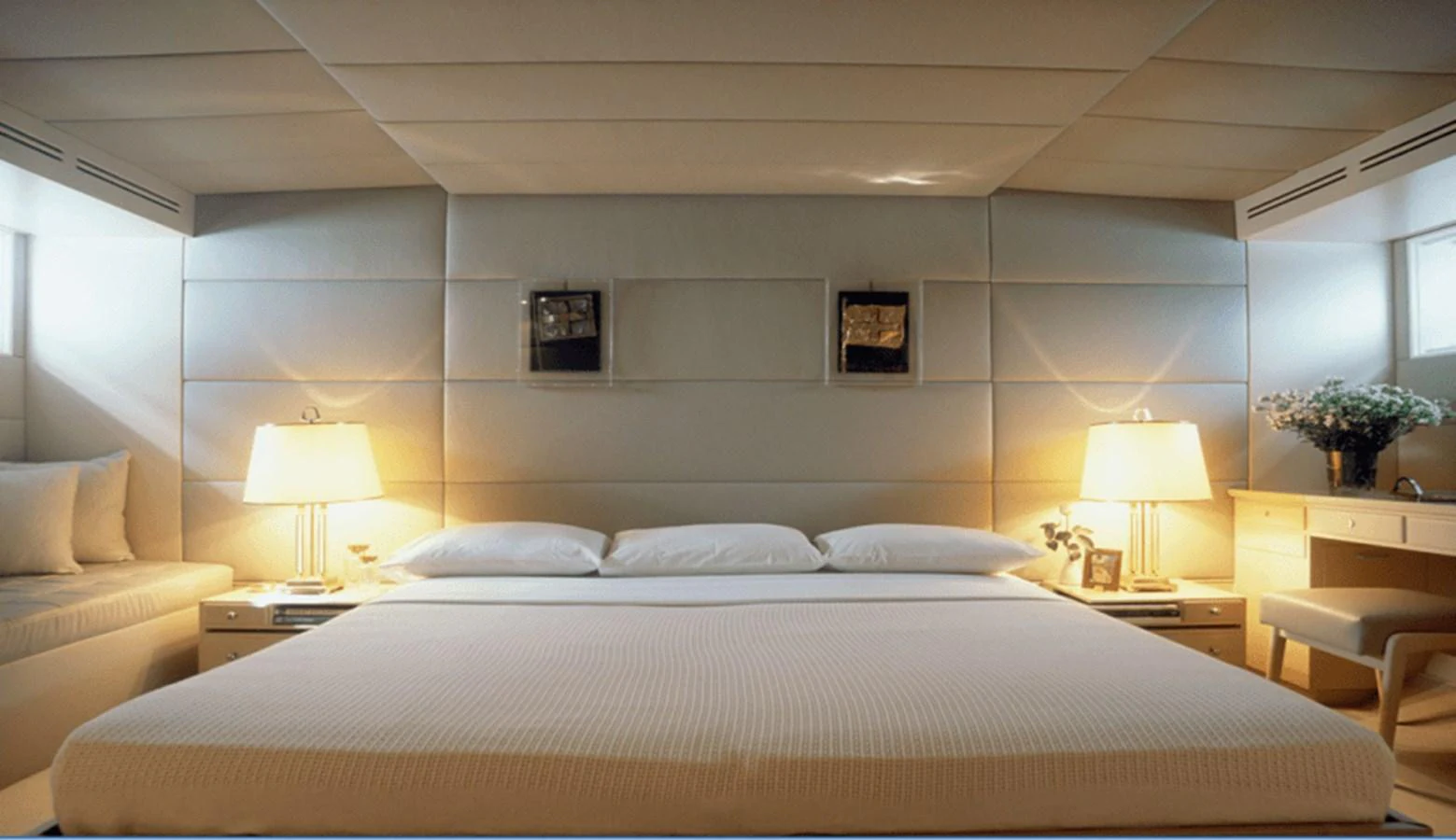 a large white bedroom with a large bed and a white bed aboard ALLAHOU Yacht for Sale