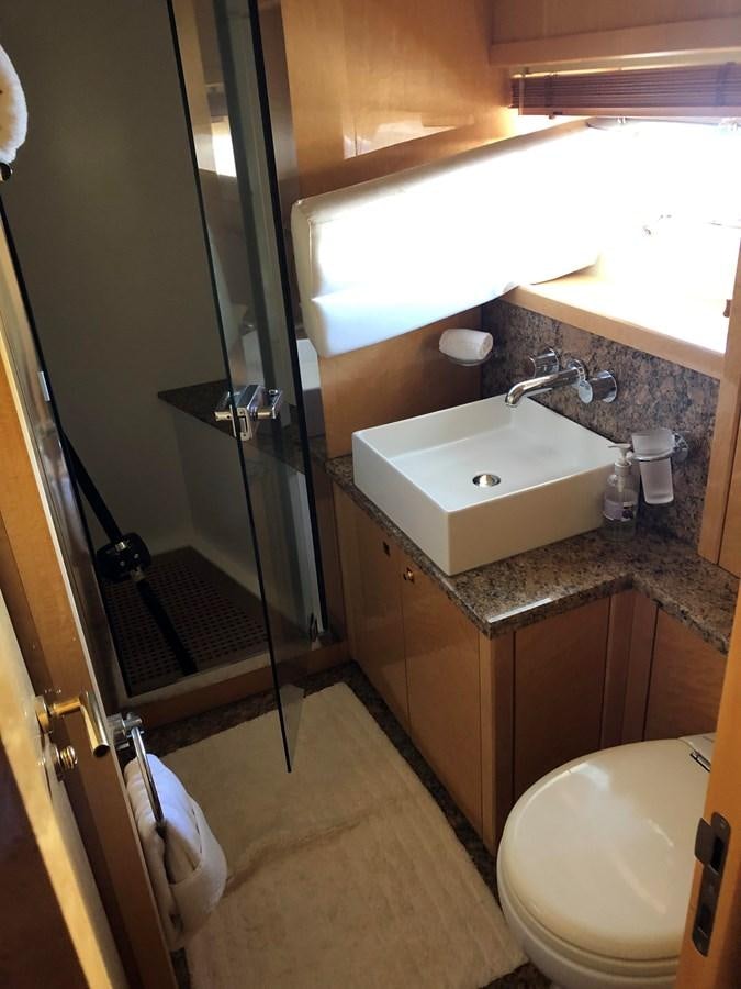 a bathroom with a sink and toilet aboard UNICO Yacht for Sale