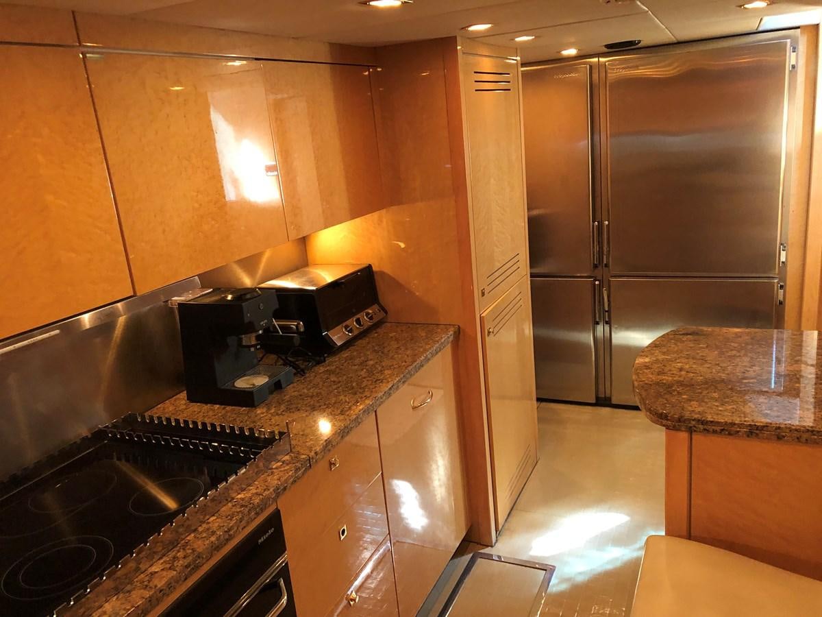 a kitchen with stainless steel appliances aboard UNICO Yacht for Sale