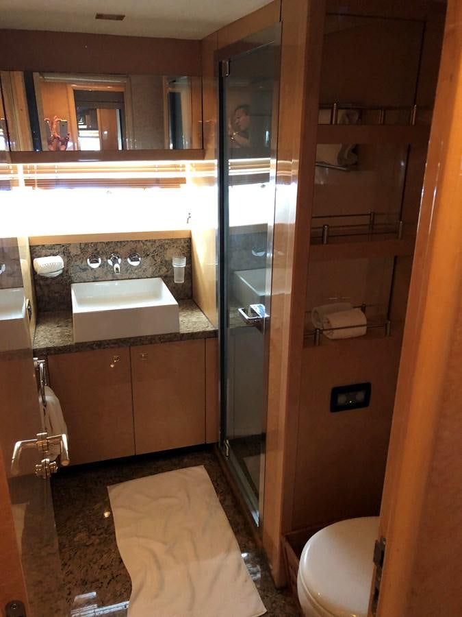 a bathroom with a large mirror aboard UNICO Yacht for Sale
