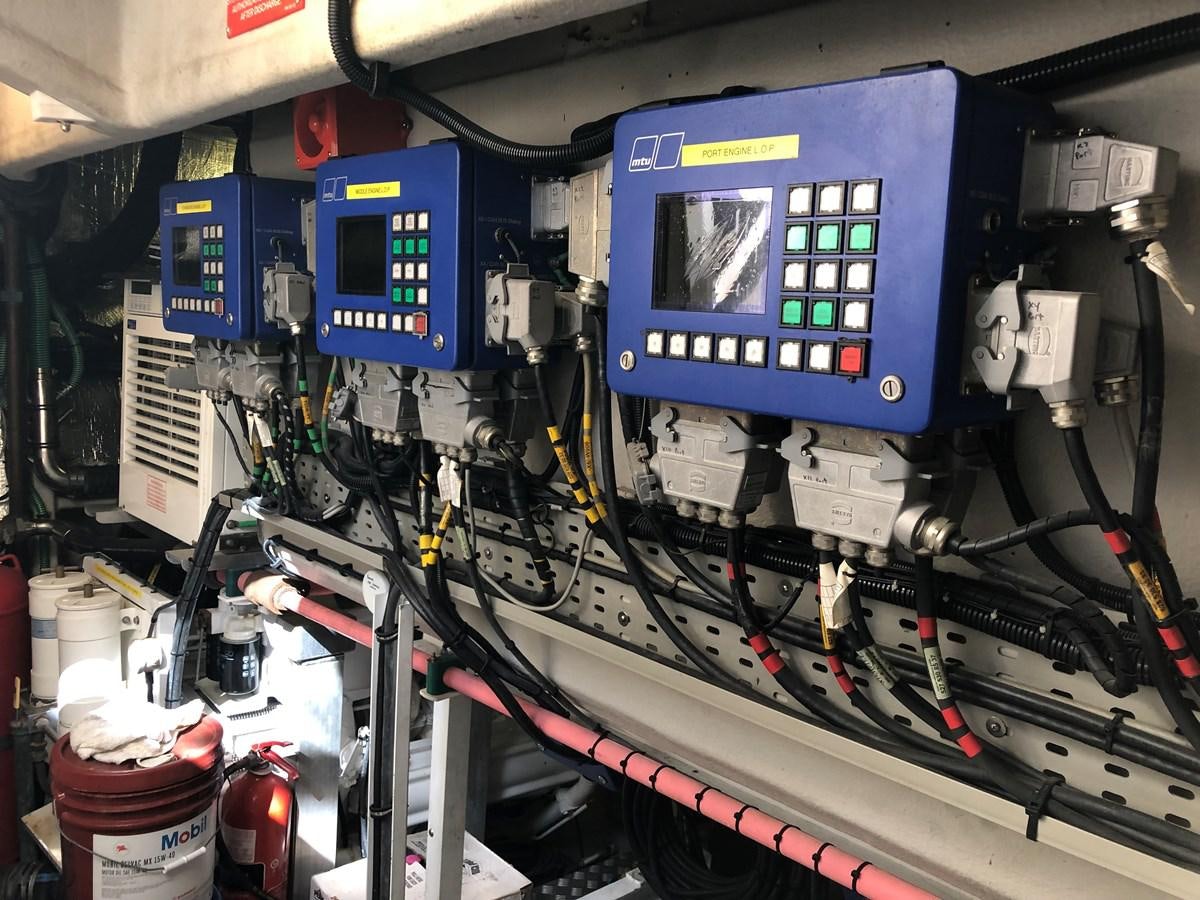 a machine with wires and a blue box aboard UNICO Yacht for Sale