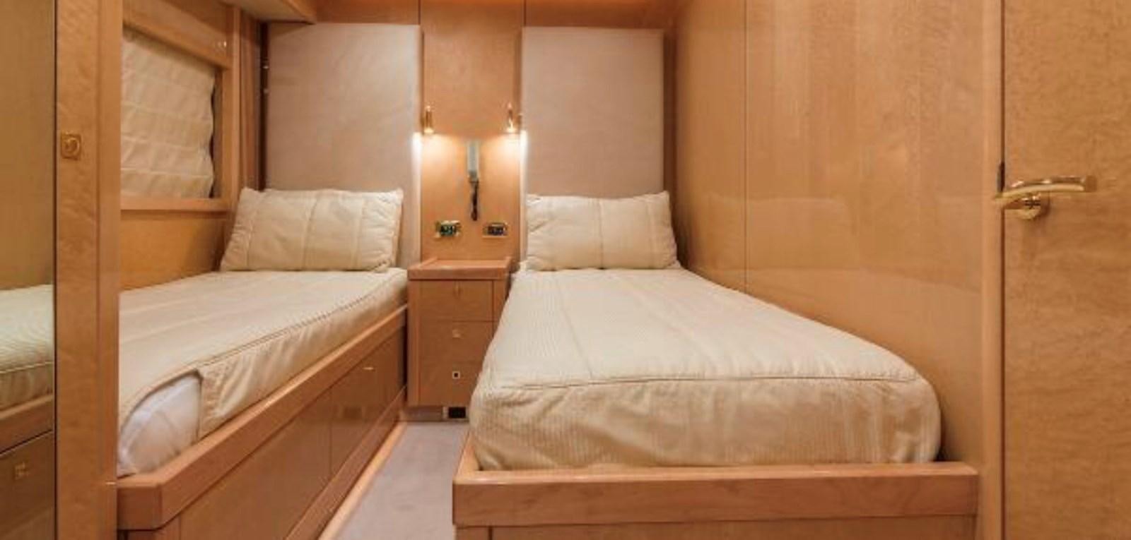 a couple of beds in a room aboard UNICO Yacht for Sale