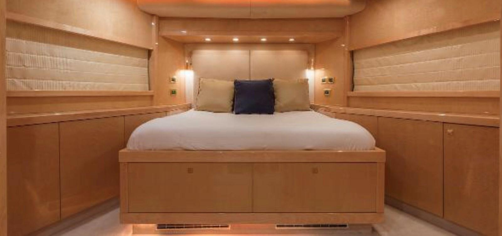 a bed in a room aboard UNICO Yacht for Sale