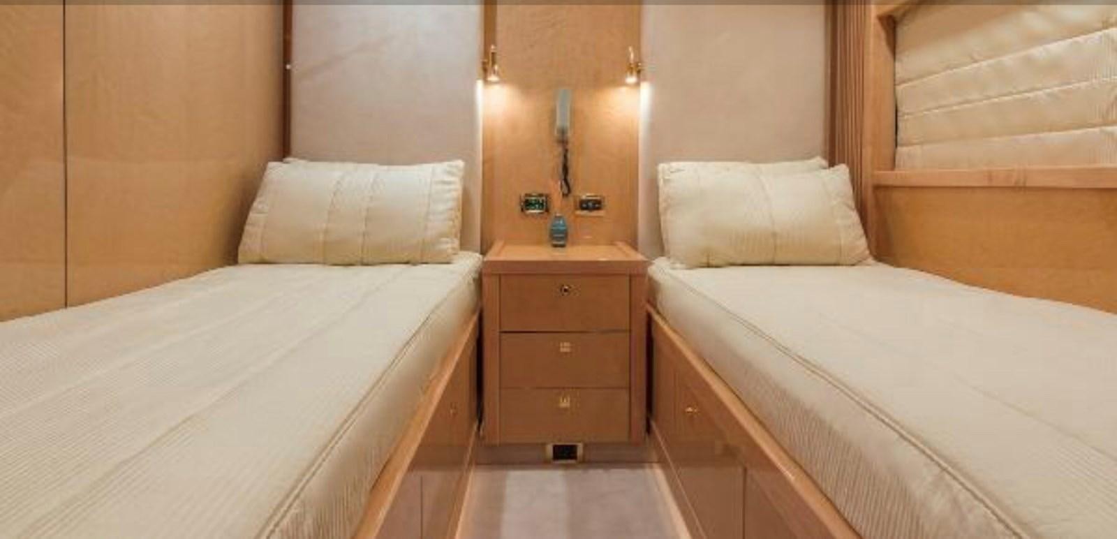 a room with two beds aboard UNICO Yacht for Sale