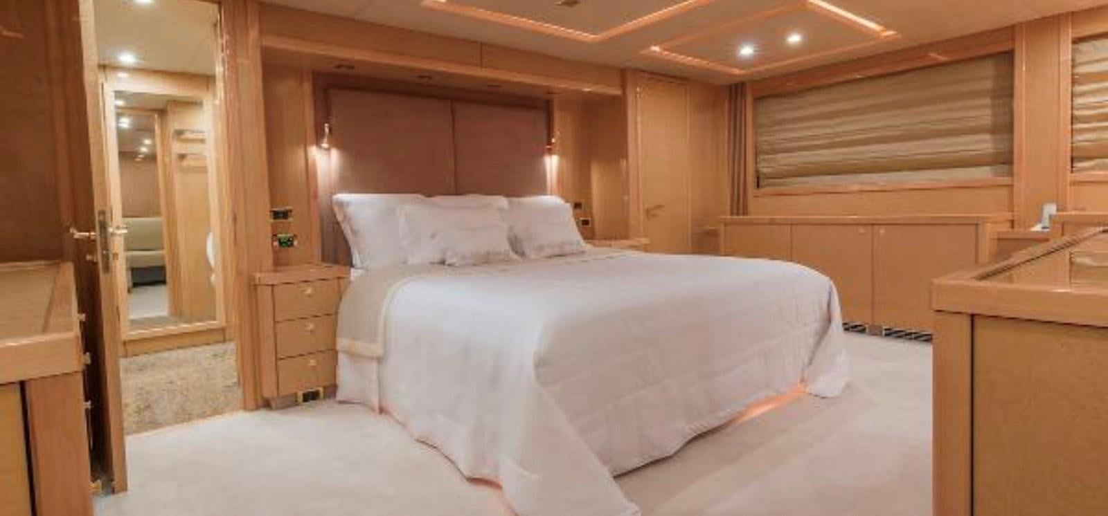 a bed in a room aboard UNICO Yacht for Sale