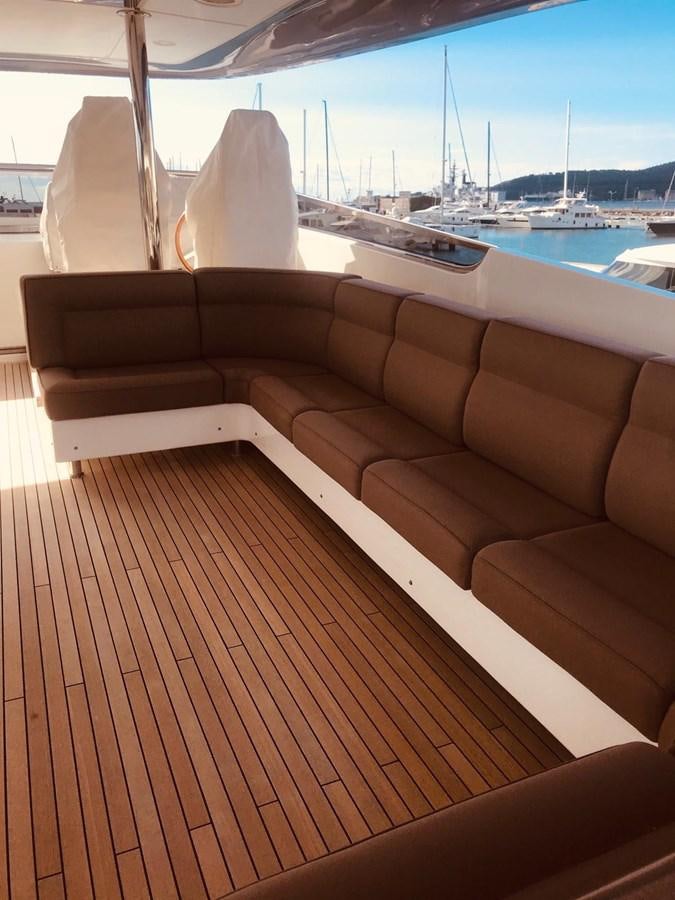 a wood deck overlooking a body of water aboard FIFTH AVENUE Yacht for Sale