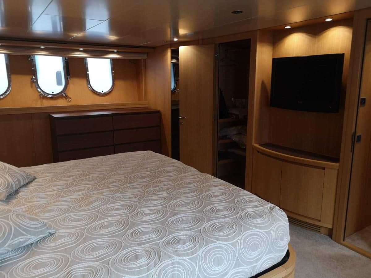 a bed in a room aboard FIFTH AVENUE Yacht for Sale