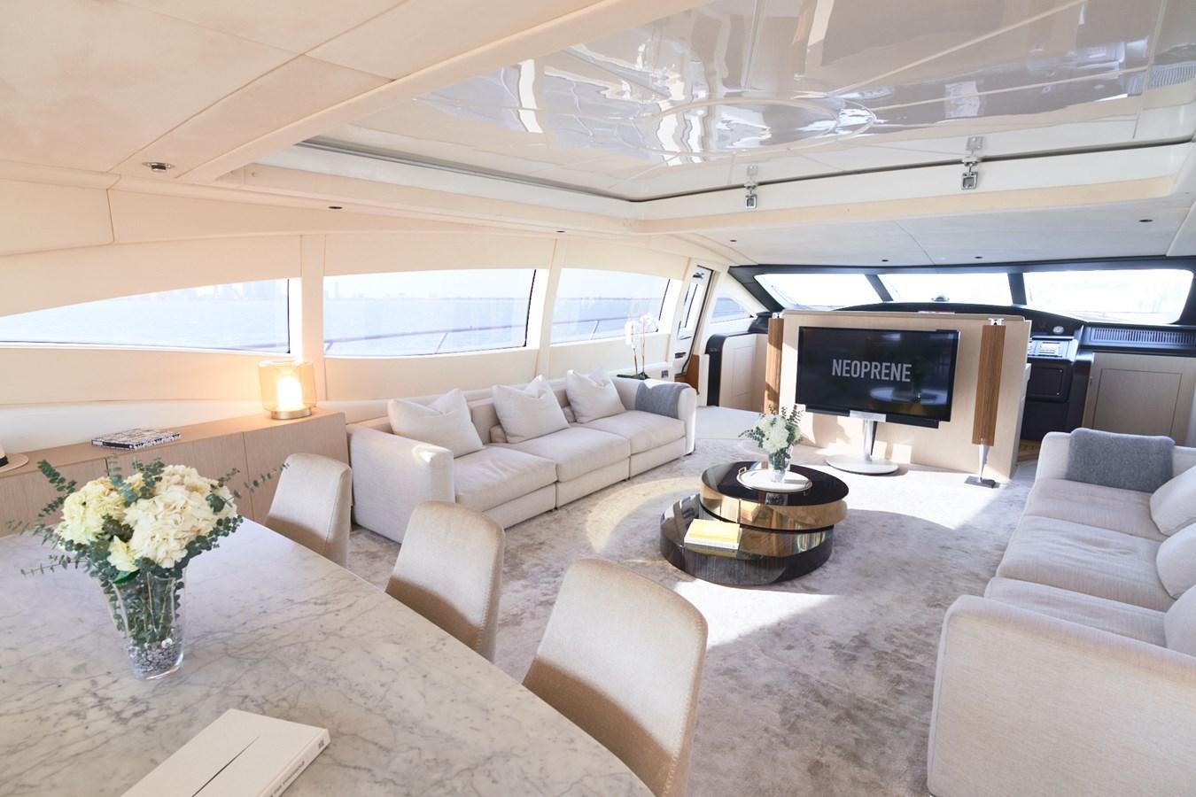 a large living room with white furniture aboard MANGUSTA 108 Yacht for Sale