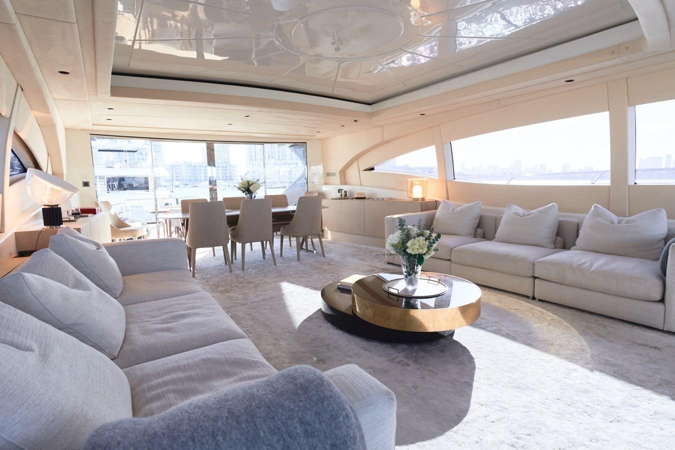 a living room with a large window aboard MANGUSTA 108 Yacht for Sale