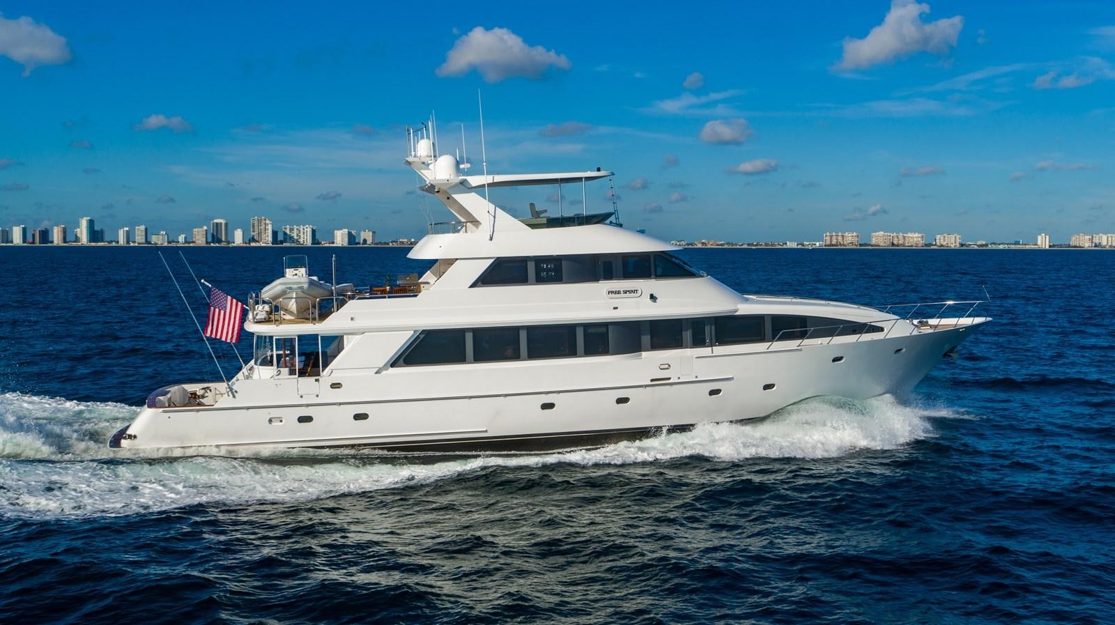 a large white boat on the water aboard FREE SPIRIT Yacht for Sale