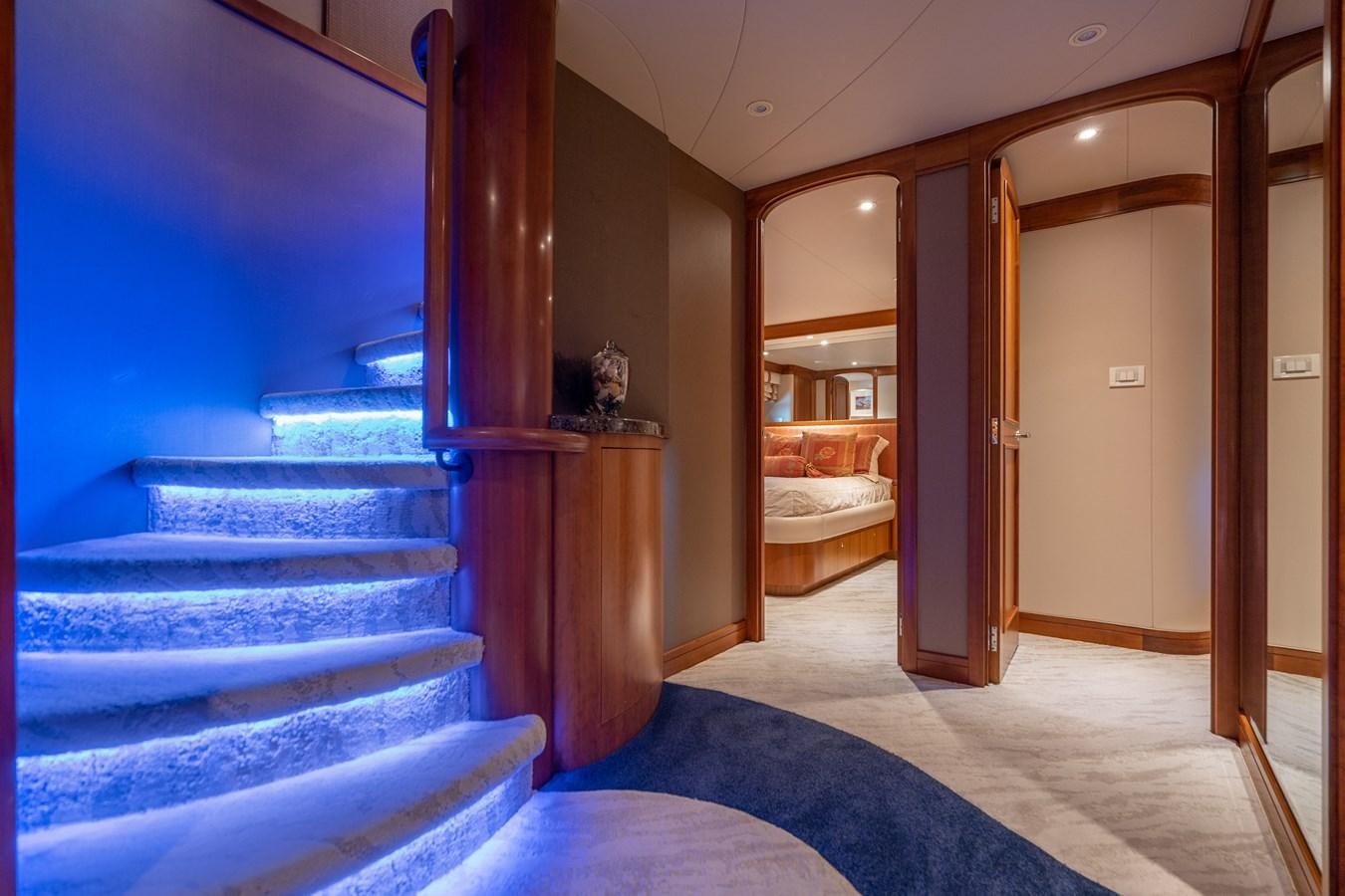 a room with a bed and a mirror aboard FREE SPIRIT Yacht for Sale
