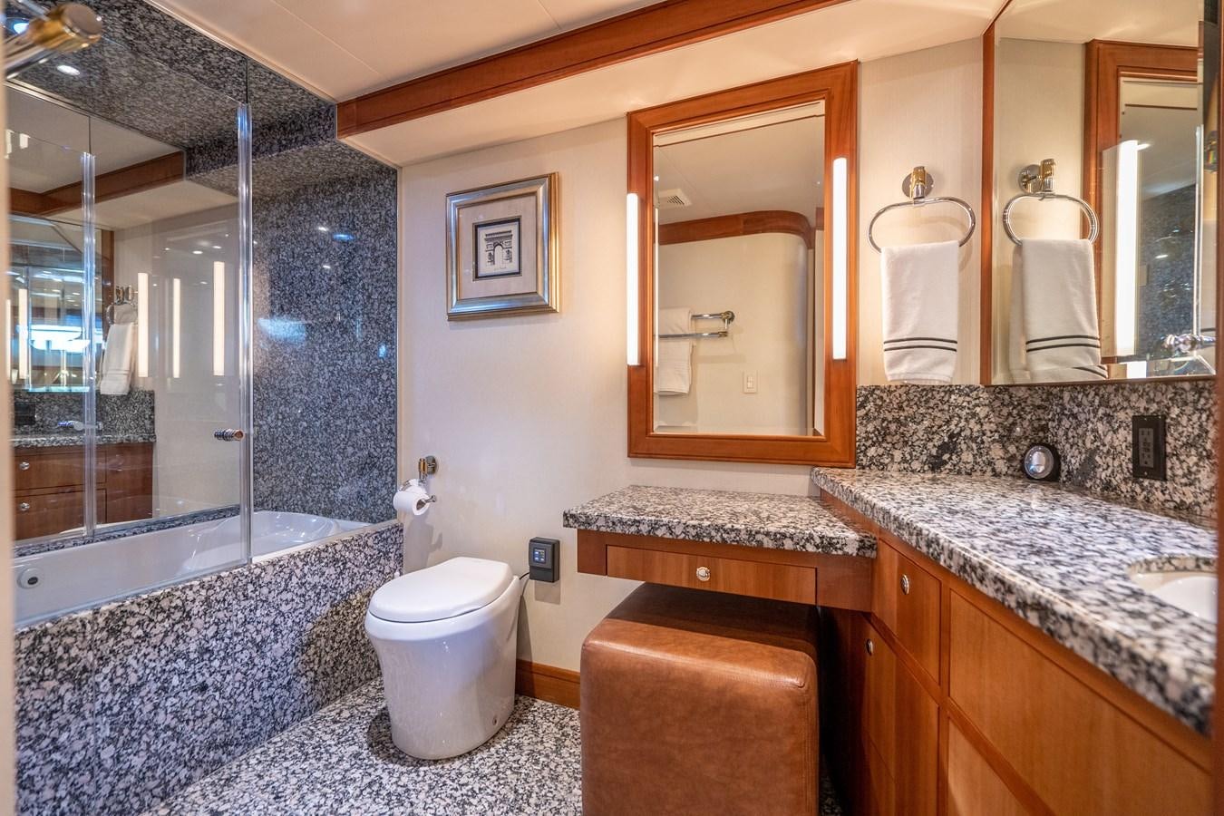 a bathroom with a glass shower aboard FREE SPIRIT Yacht for Sale