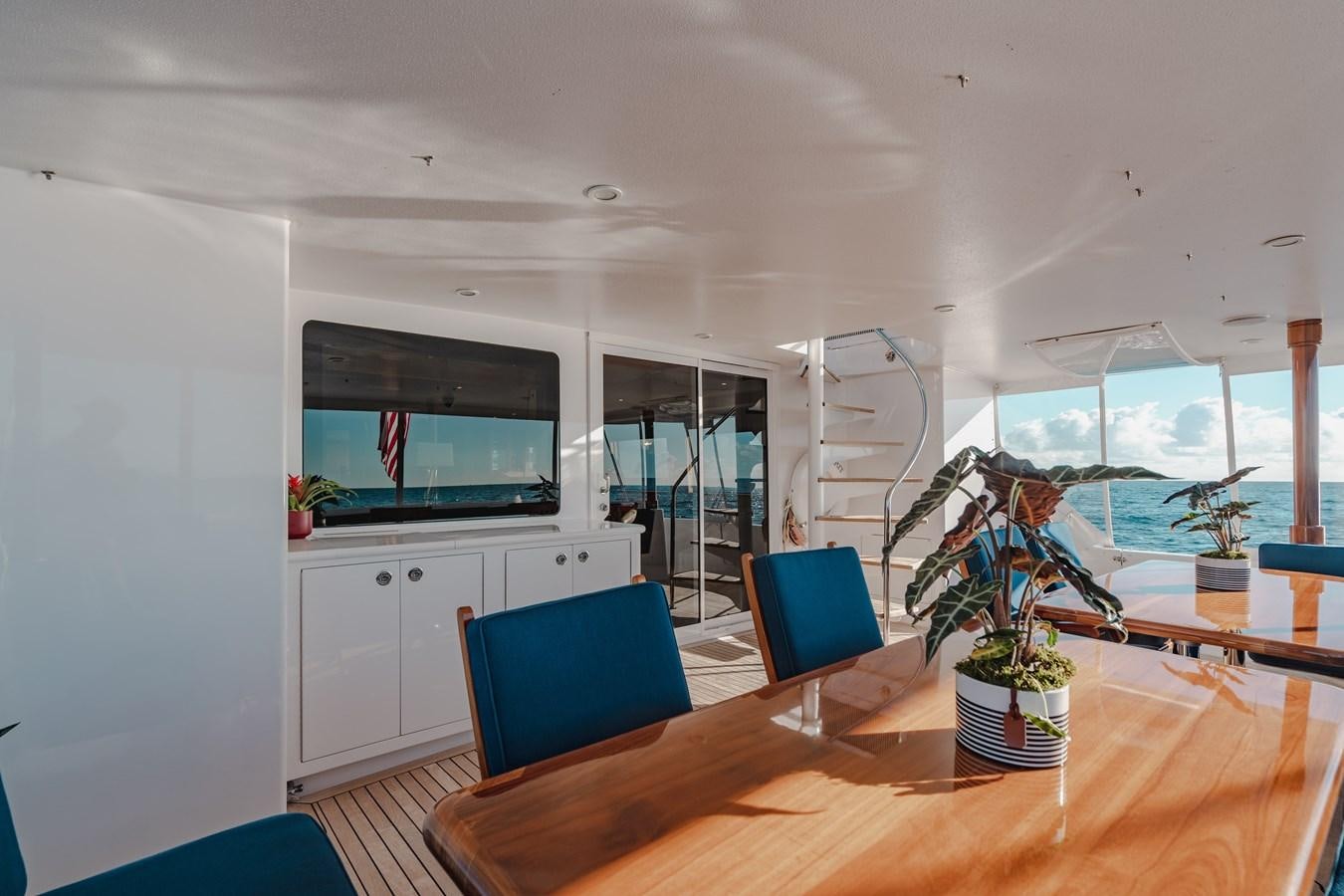 a person sitting at a table aboard FREE SPIRIT Yacht for Sale