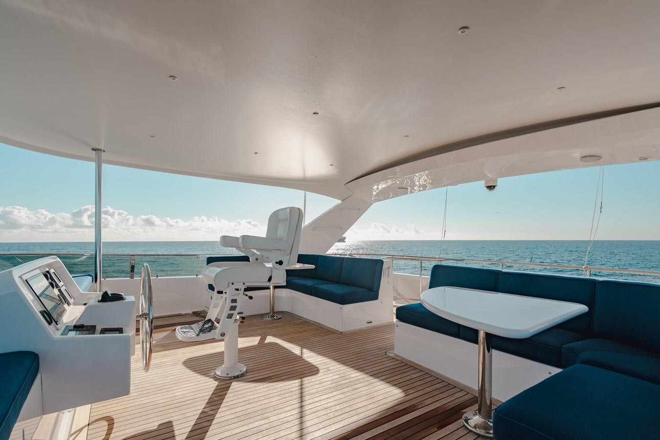 a room with a view of the ocean and a deck aboard FREE SPIRIT Yacht for Sale