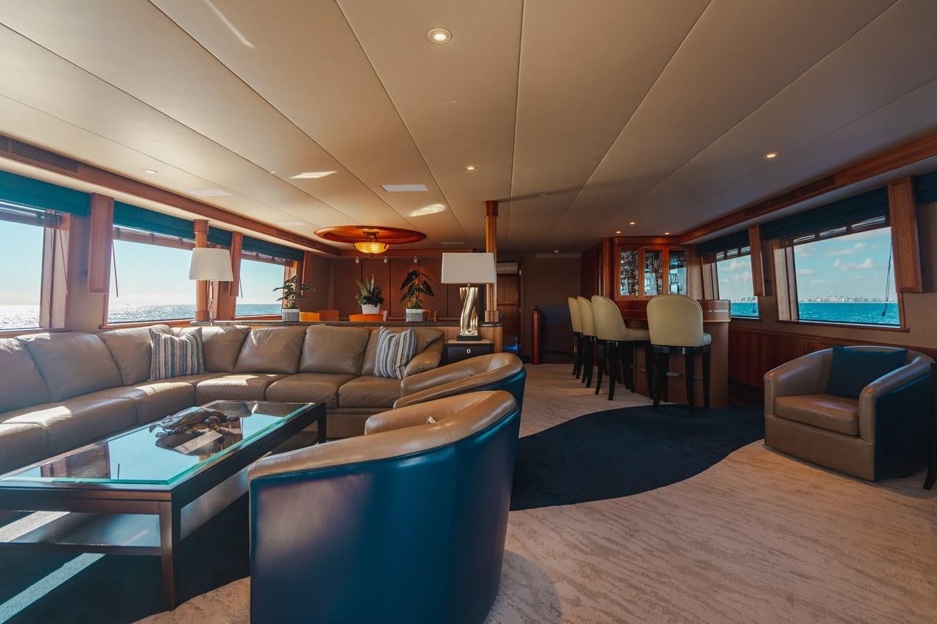 a living room with a large screen aboard FREE SPIRIT Yacht for Sale