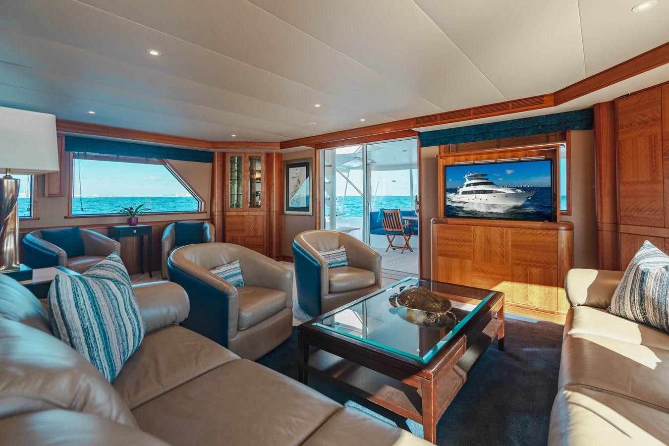 a living room with a fireplace aboard FREE SPIRIT Yacht for Sale