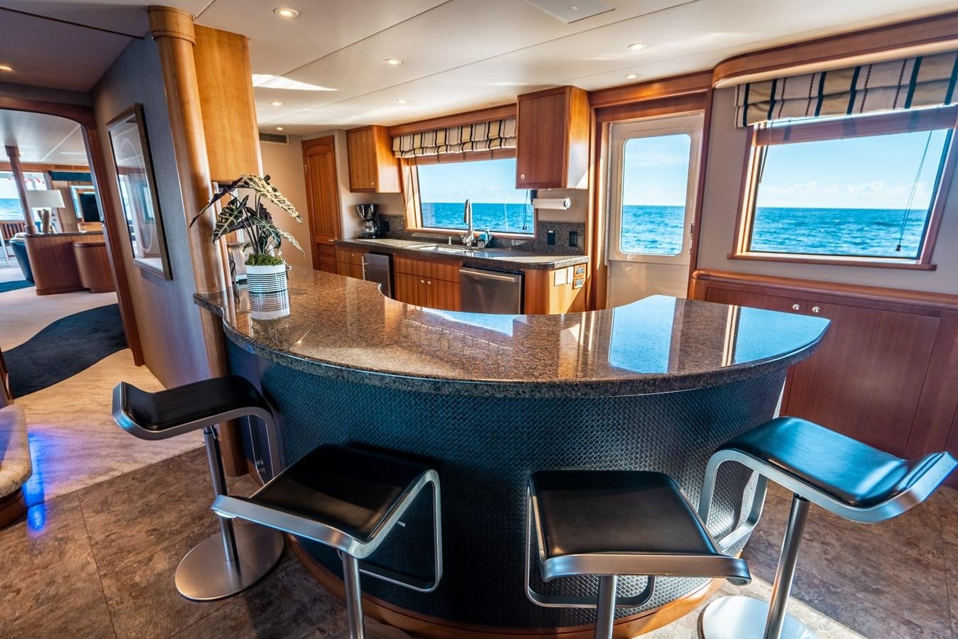 a large kitchen with a pool table aboard FREE SPIRIT Yacht for Sale