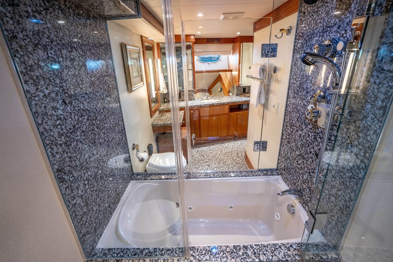 a bathroom with a large tub aboard FREE SPIRIT Yacht for Sale