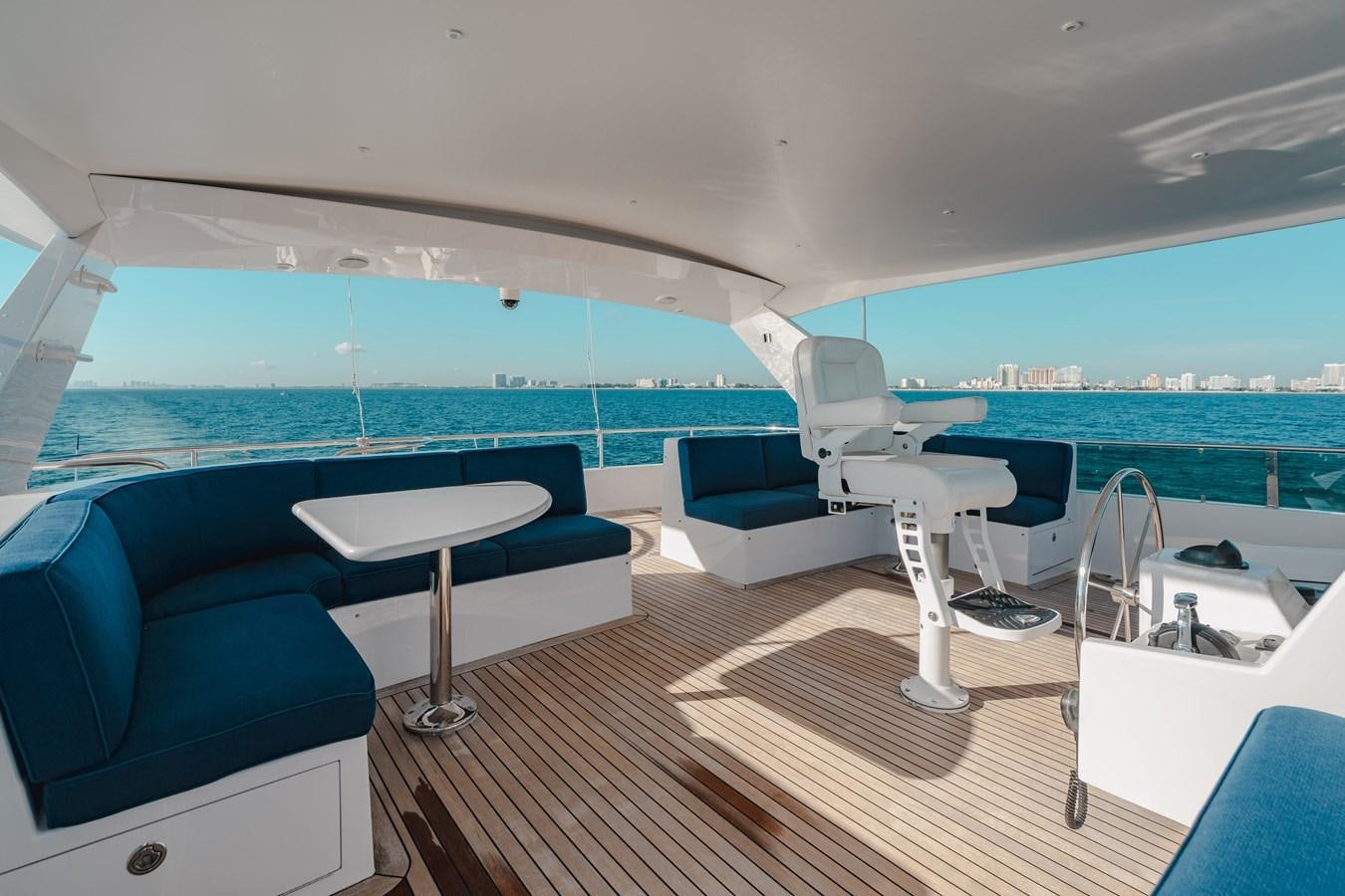 a room with a deck and a view of the water aboard FREE SPIRIT Yacht for Sale