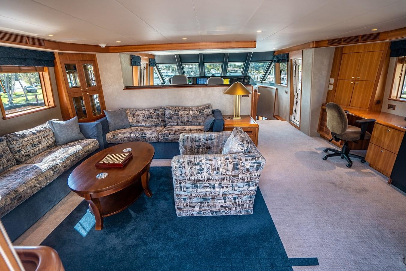 a living room with a couch and a coffee table aboard FREE SPIRIT Yacht for Sale