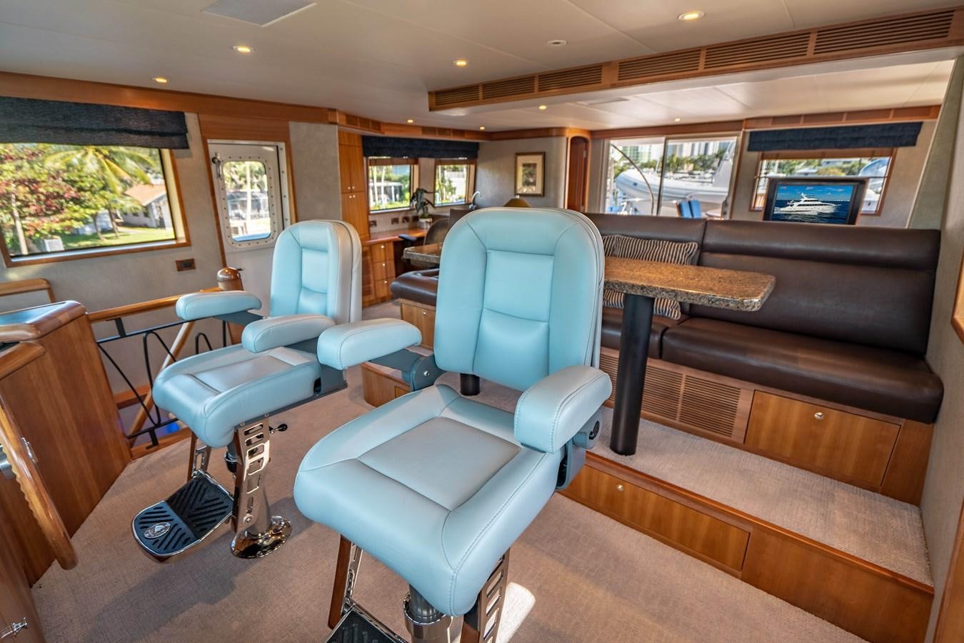 a vehicle with seats and a table aboard FREE SPIRIT Yacht for Sale