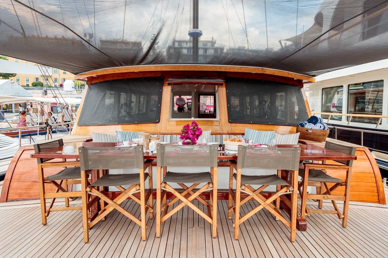 a table with chairs on it aboard VITA DOLCE Yacht for Sale
