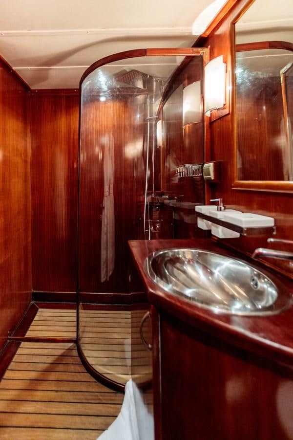 a bathroom with a sink and a shower aboard VITA DOLCE Yacht for Sale
